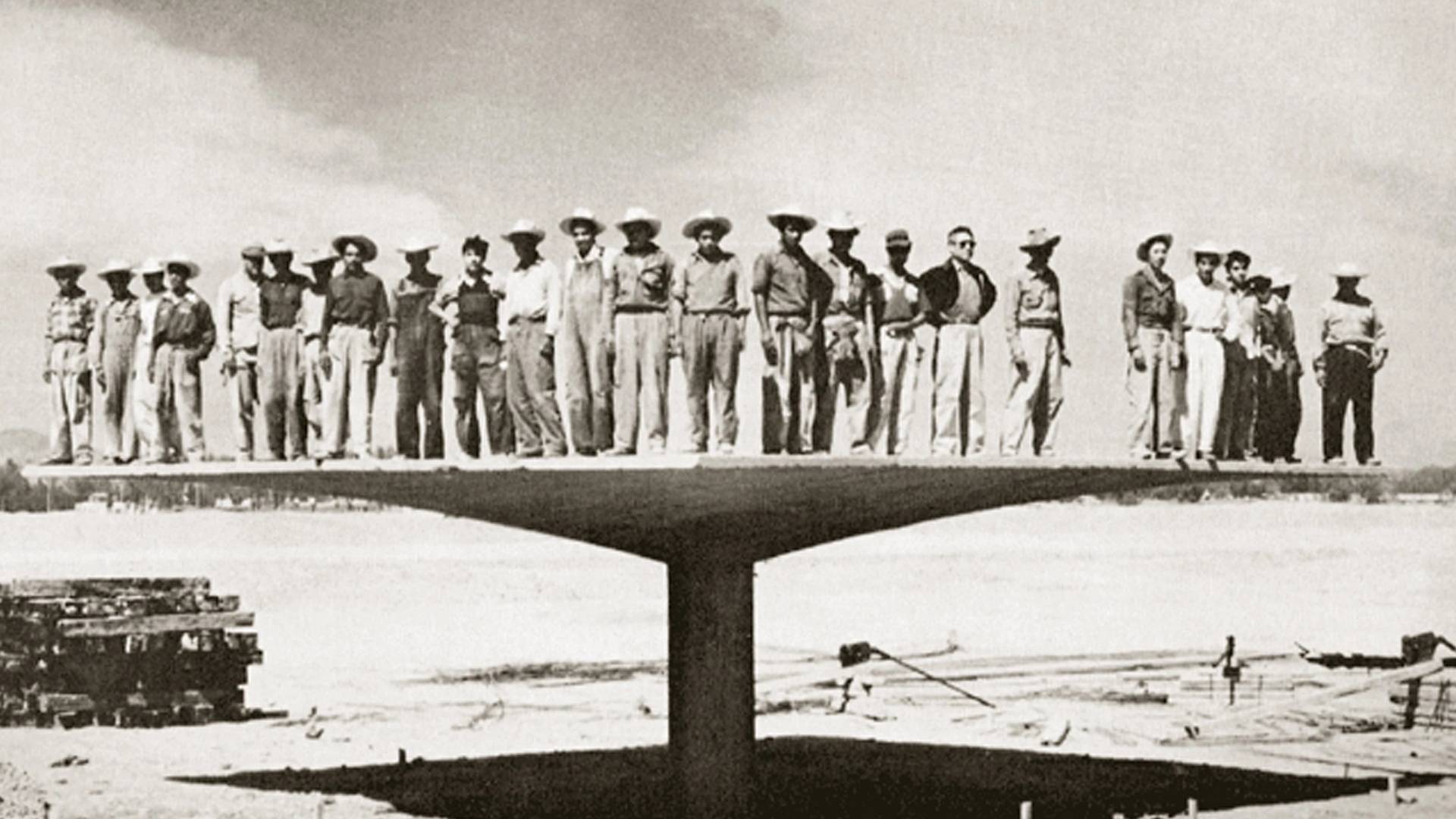 Unknown author - Félix Candela and his construction team during the load testing of a reinforced concrete 'umbrella' structure, circa 1950